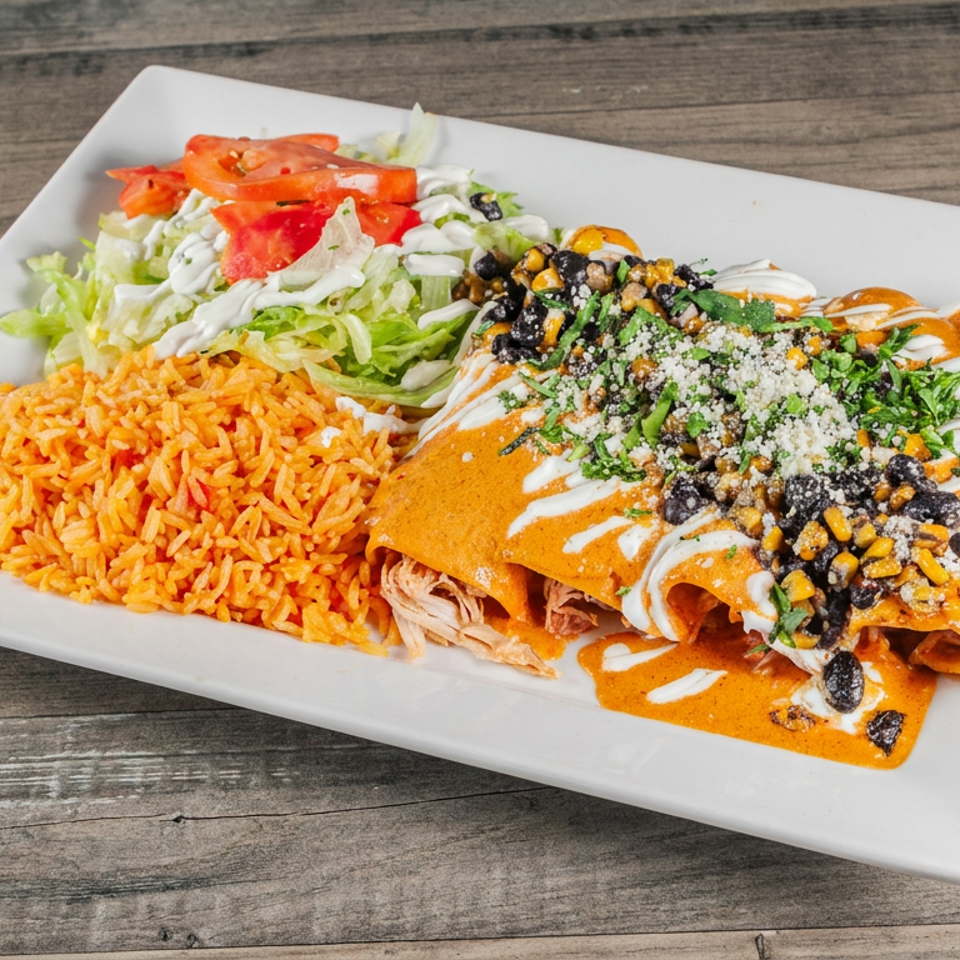 Plate of enchiladas topped with black beans, corn, herbs, and cream, served with Mexican rice and lettuce salad.